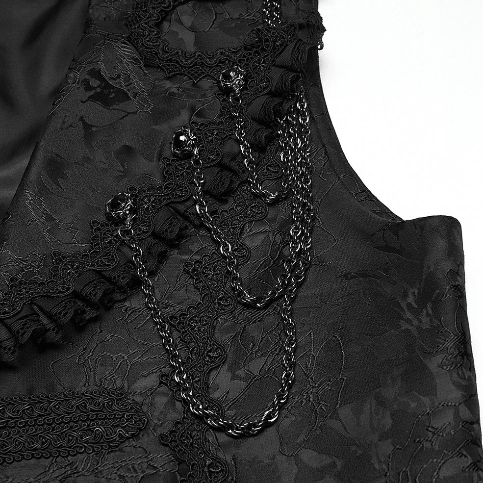 Detailed view of gothic waistcoat decoration featuring metal chains and ruffled lace embellishments