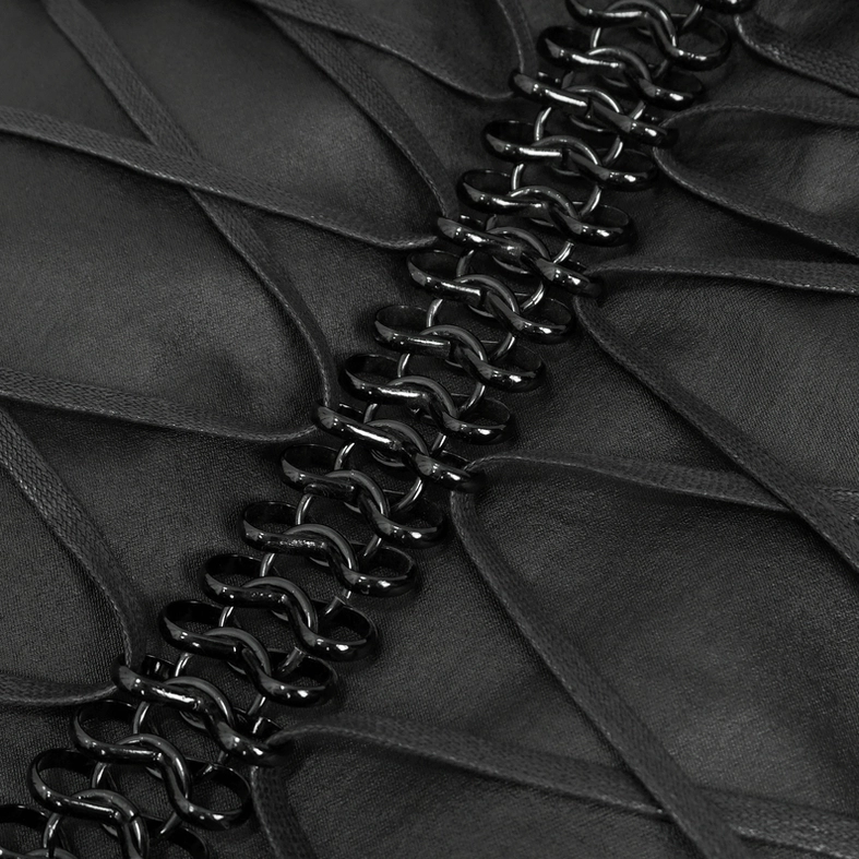 Macro close-up of thick black chain trim and polished metal fittings on gothic waistcoat back