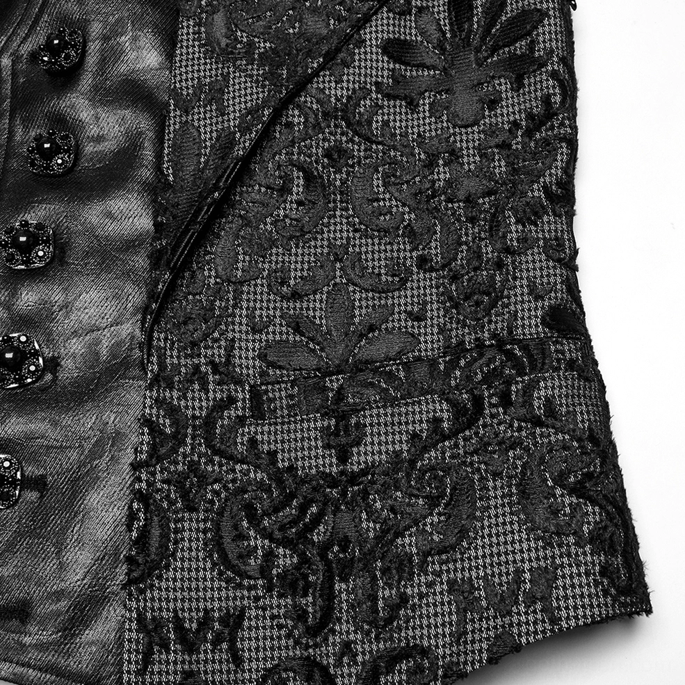 Close-up of decorative jeweled buttons and floral damask pattern on gothic embroidered waistcoat