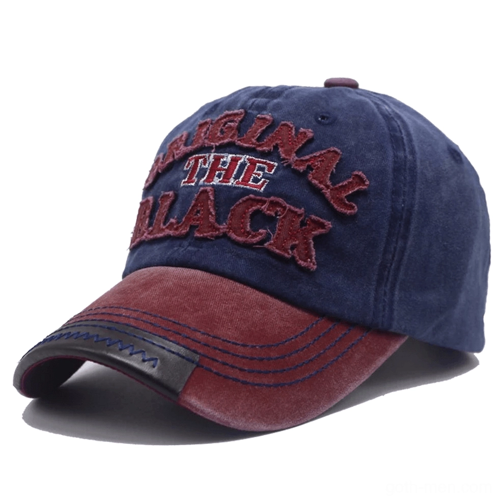Burgundy washed gothic baseball cap with blue contrast brim, red accent stitching, and embroidered letter logo front