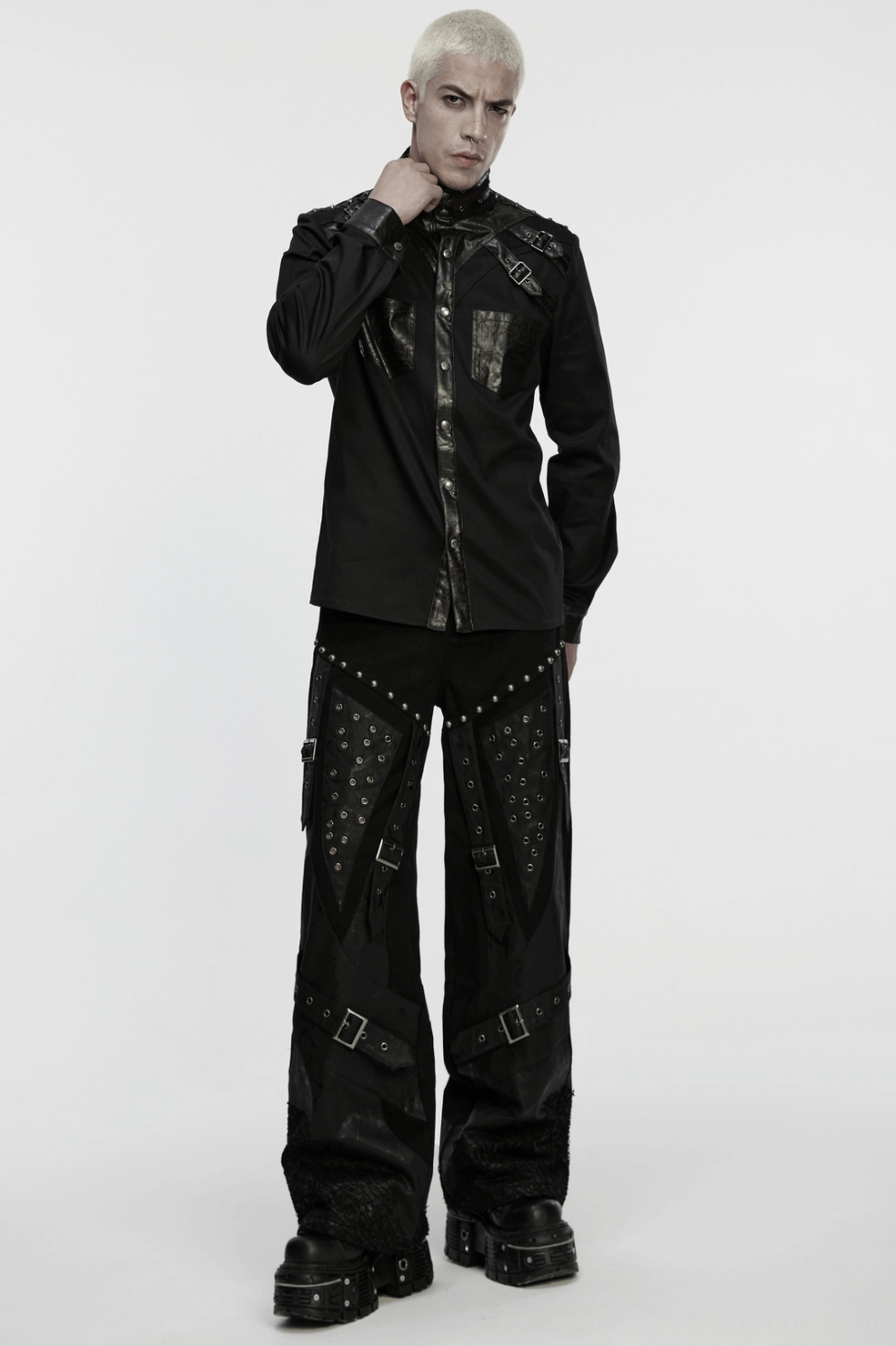 Black gothic pants design featuring irregular panels and layered material construction