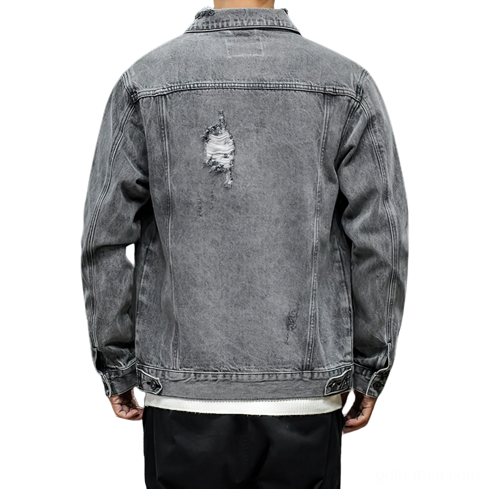 Grey denim jacket back view on model showing distressed back panel detailing and cuff button adjustments - alternative fashion
