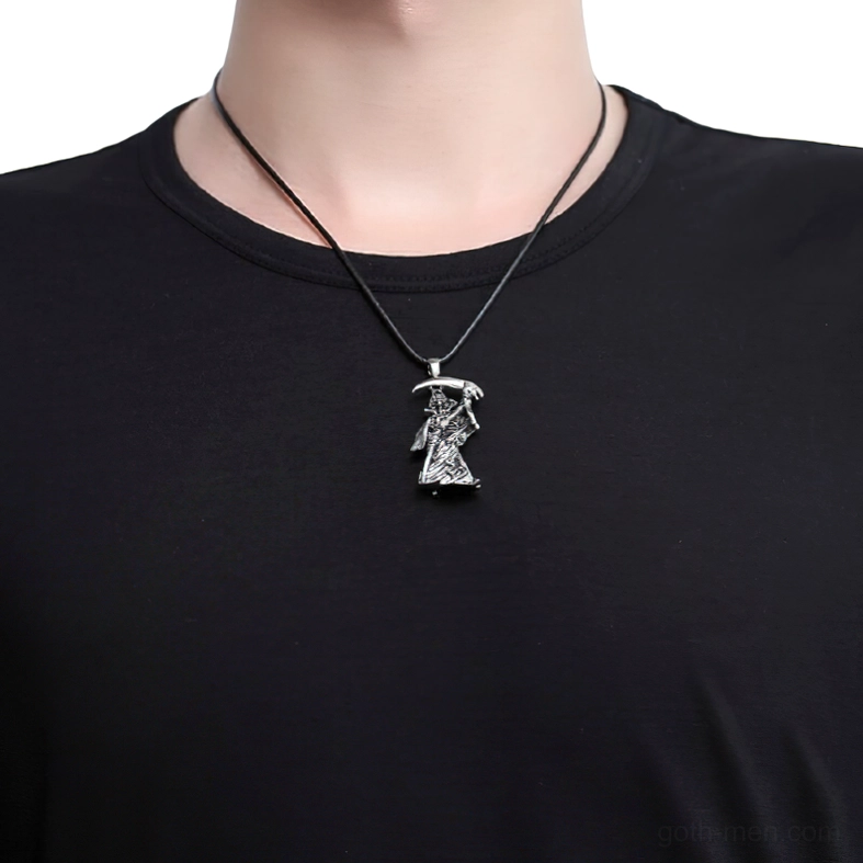 Grim reaper skull pendant worn on male neck stainless steel gothic necklace close-up on black clothing