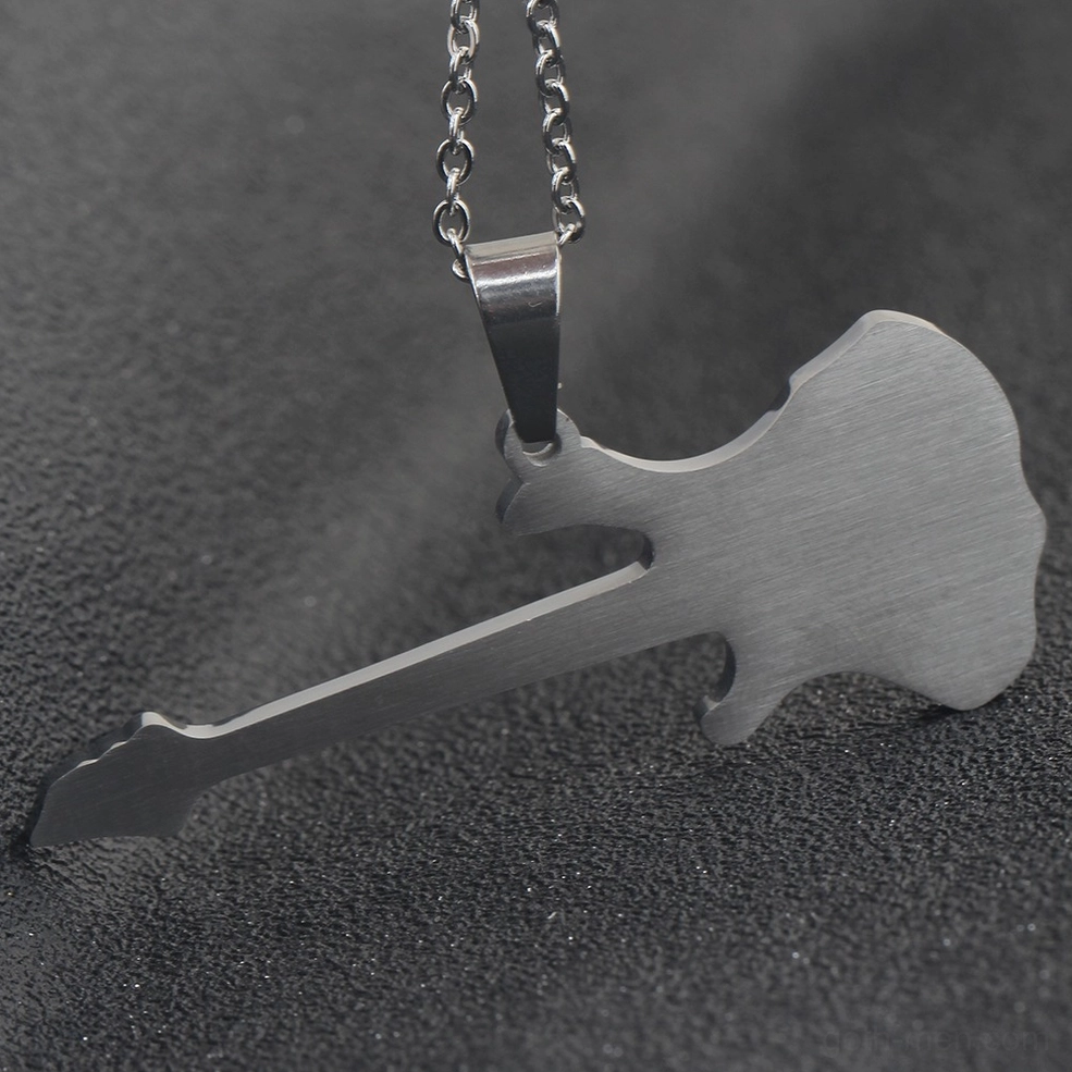 Side angle view of single-tone silver guitar pendant showing brushed metal surface texture and three-dimensional depth