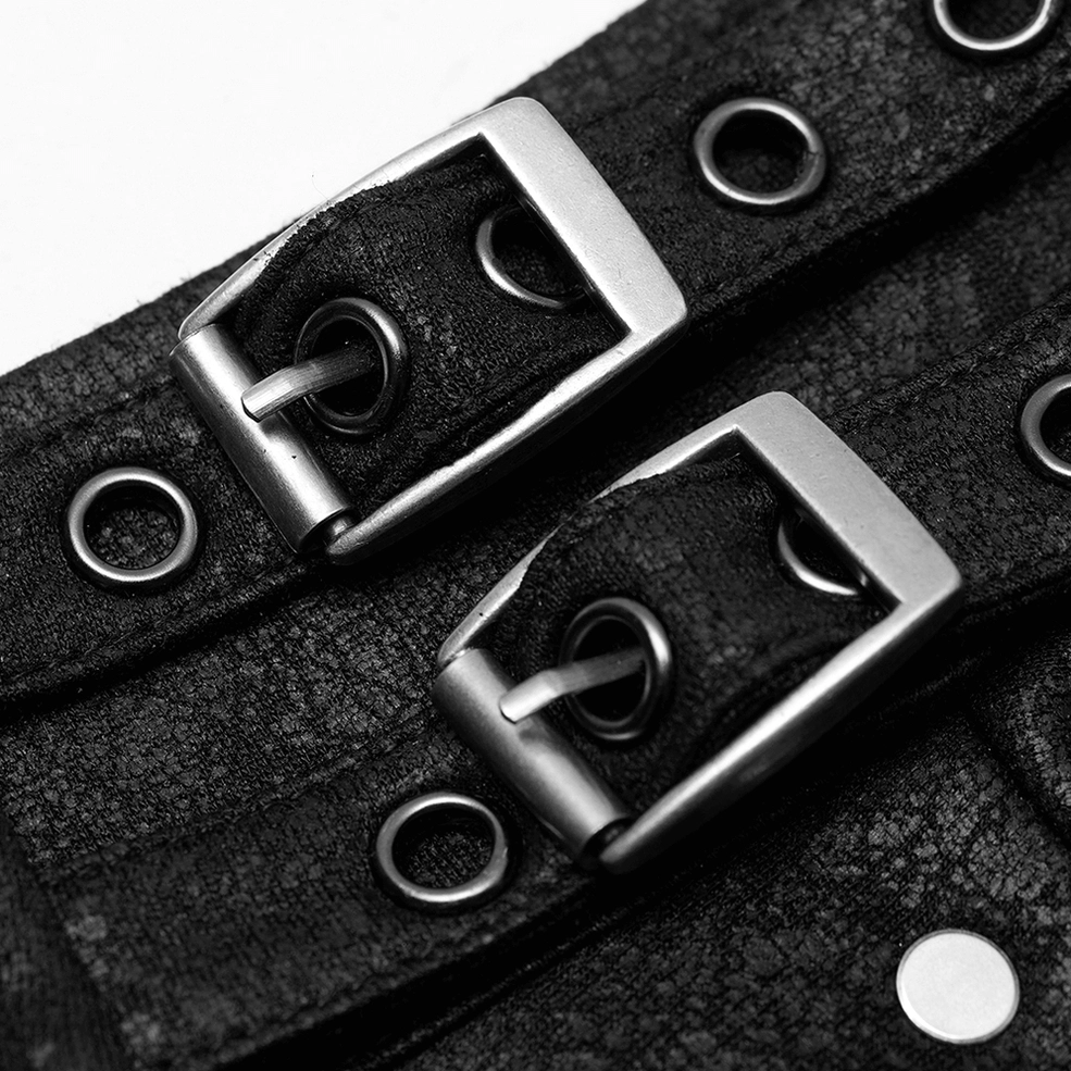 Close-up of gothic harness buckle straps - dual metal buckles and reinforced grommet holes detail