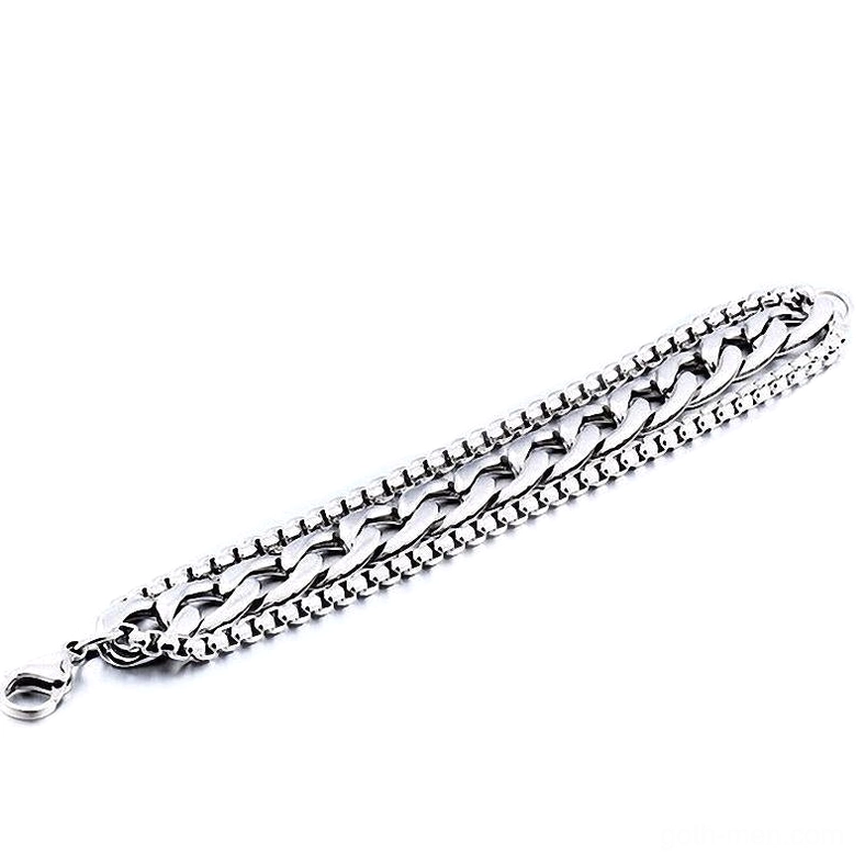 Double-layer metal chain bracelet flat lay top view with lobster clasp closure detail, stainless steel gothic jewelry on white background