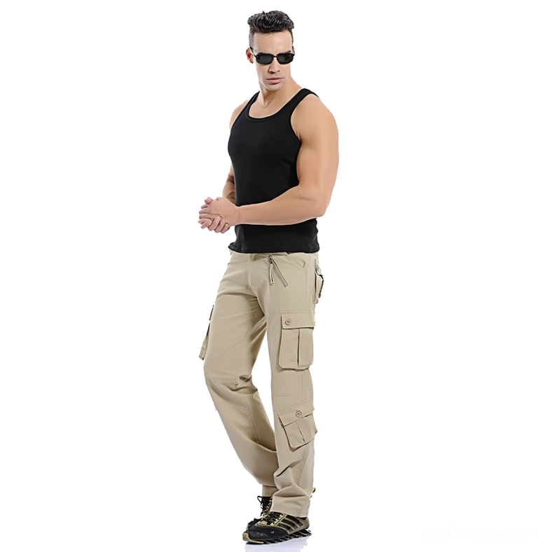 Male model wearing khaki military cargo pants full body standing pose - gothic straight leg trousers on model
