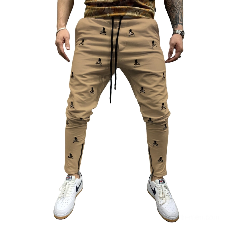Khaki colored gothic skull lace-up pencil pants with ankle zipper design, skinny fit alternative fashion trousers