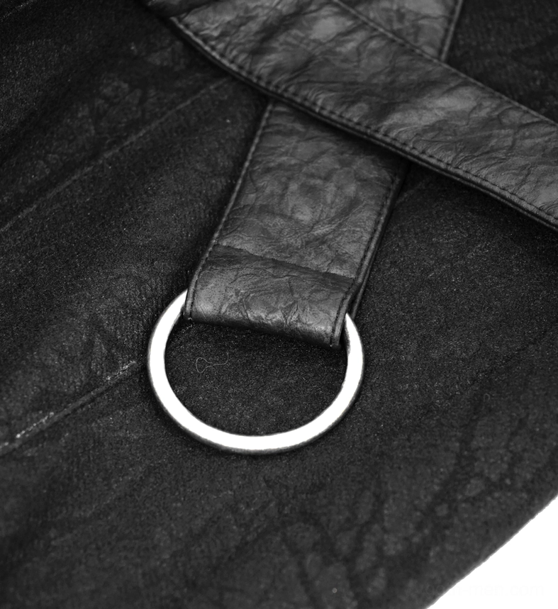 Close-up of single metal D-ring hardware attached to black leather strap on gothic kilt skirt