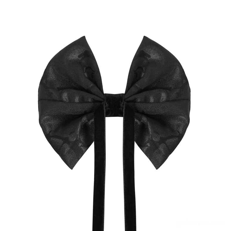 Lace-up gothic bow tie flat lay showing long black ribbon ties and jacquard fabric surface texture