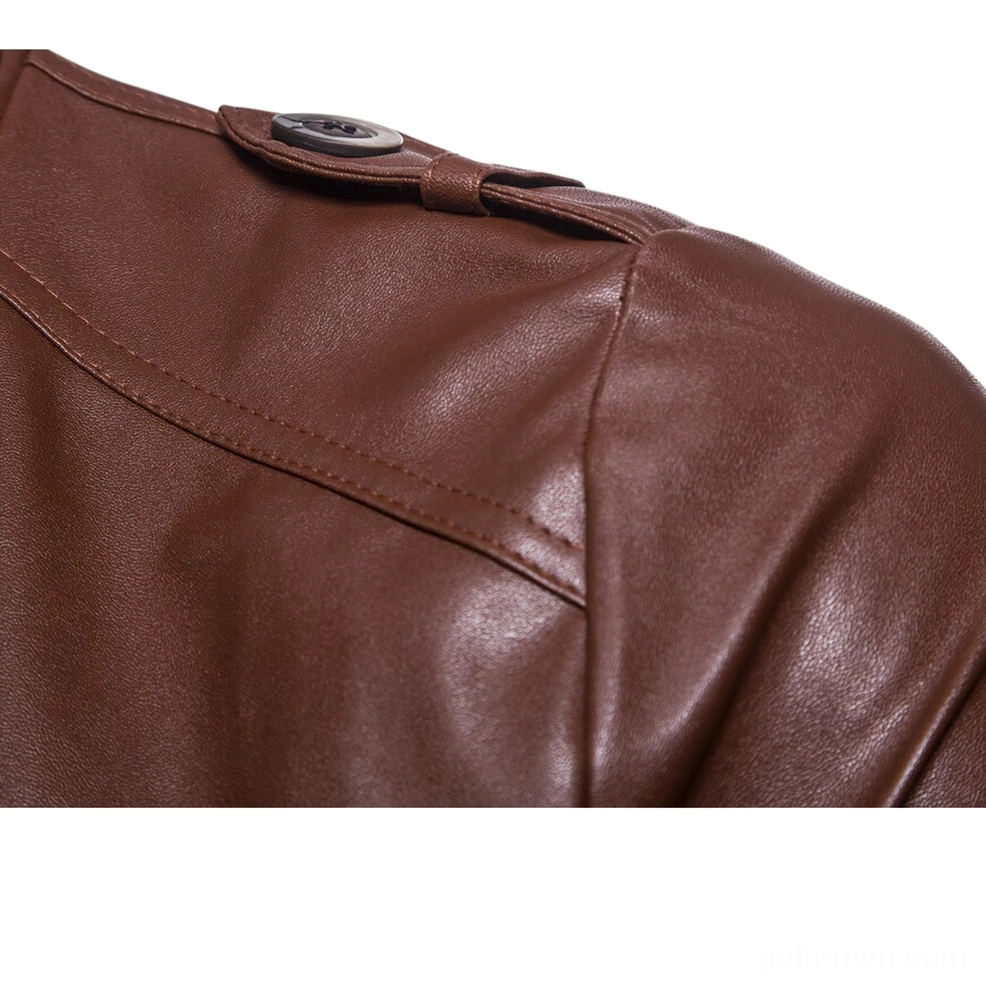 Close-up of shoulder epaulet details and decorative buckle strap on gothic leather jacket