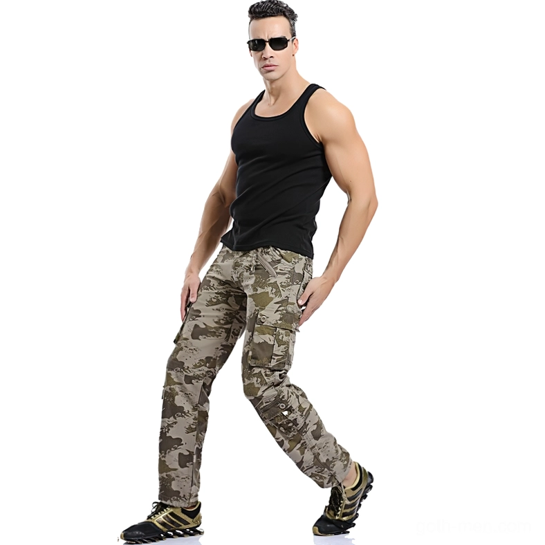 Male model in light camouflage cargo pants action pose - goth military trousers with straight fit and side pockets