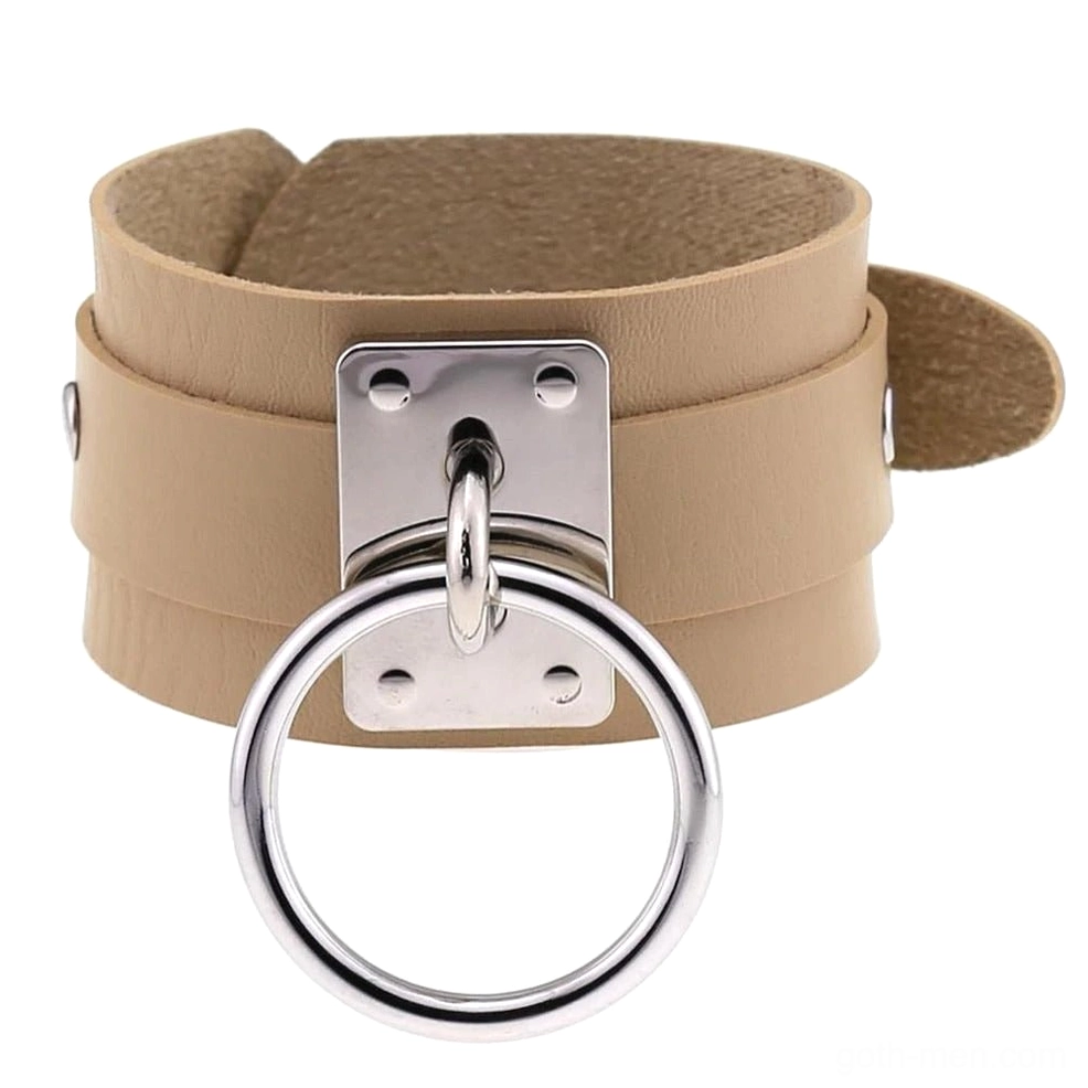 Light tan leather gothic cuff bracelet with silver accents, neutral dark fashion jewelry