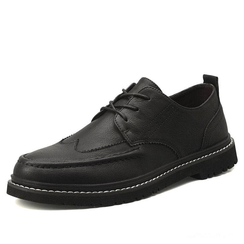 Black leather gothic dress shoes for men with stitched sole edge and classic lace-up design, front perspective