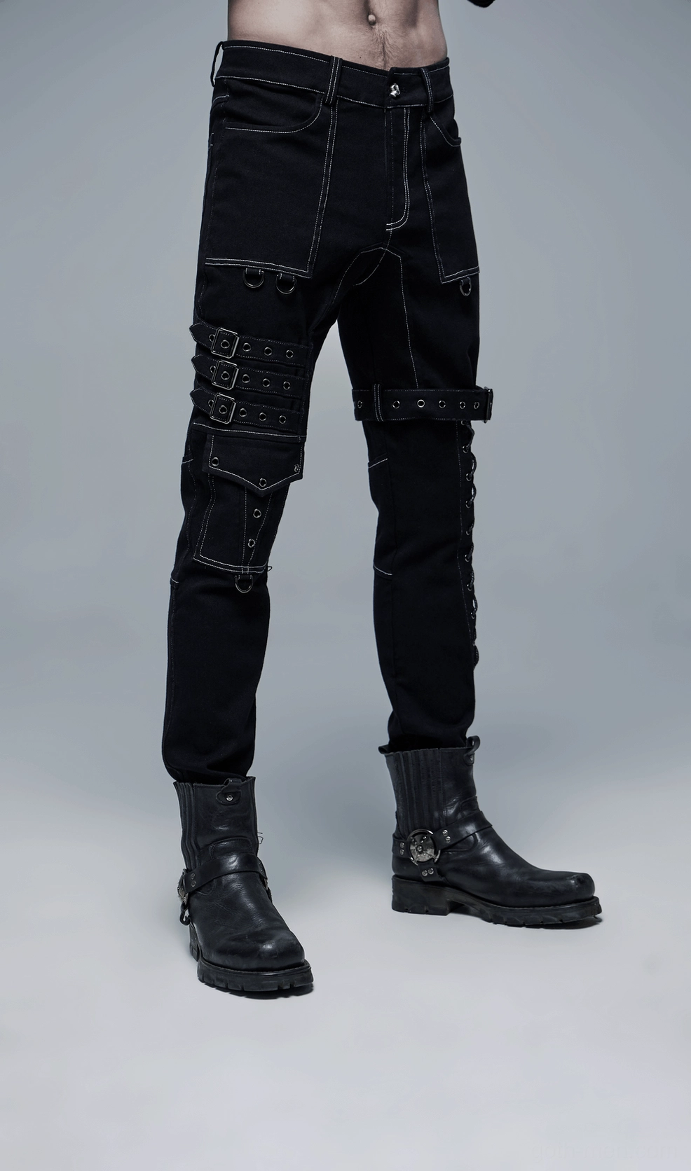 Men's gothic buckled cargo pants styled full-body fashion shot with alternative aesthetic