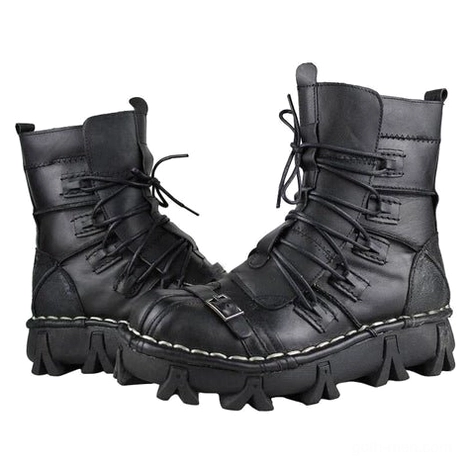 Men's genuine leather black gothic combat boots with metal buckles and multi-lace closure, three-quarter front view showing thick lug outsole and industrial details