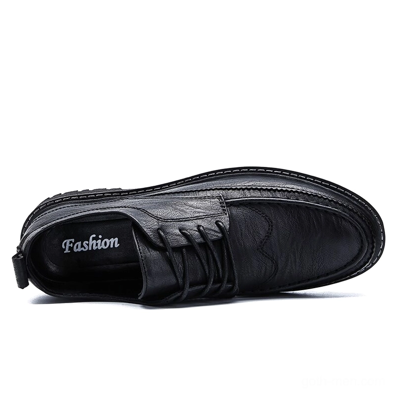 Gothic men's leather shoes heel tab and reinforced back panel construction detail