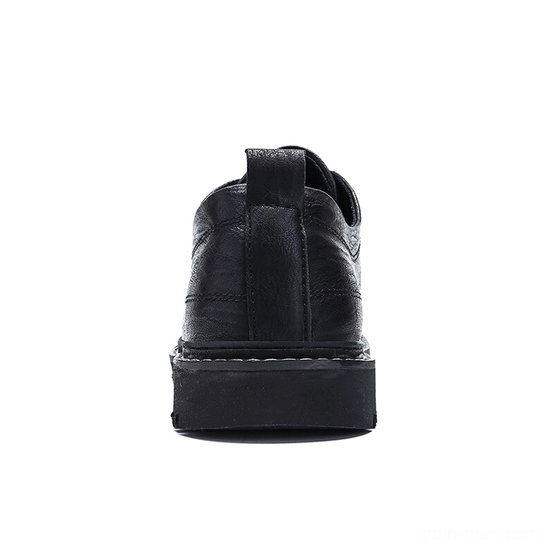 Close-up detail of gothic men's leather shoes showing premium sheepskin insole and lacing system