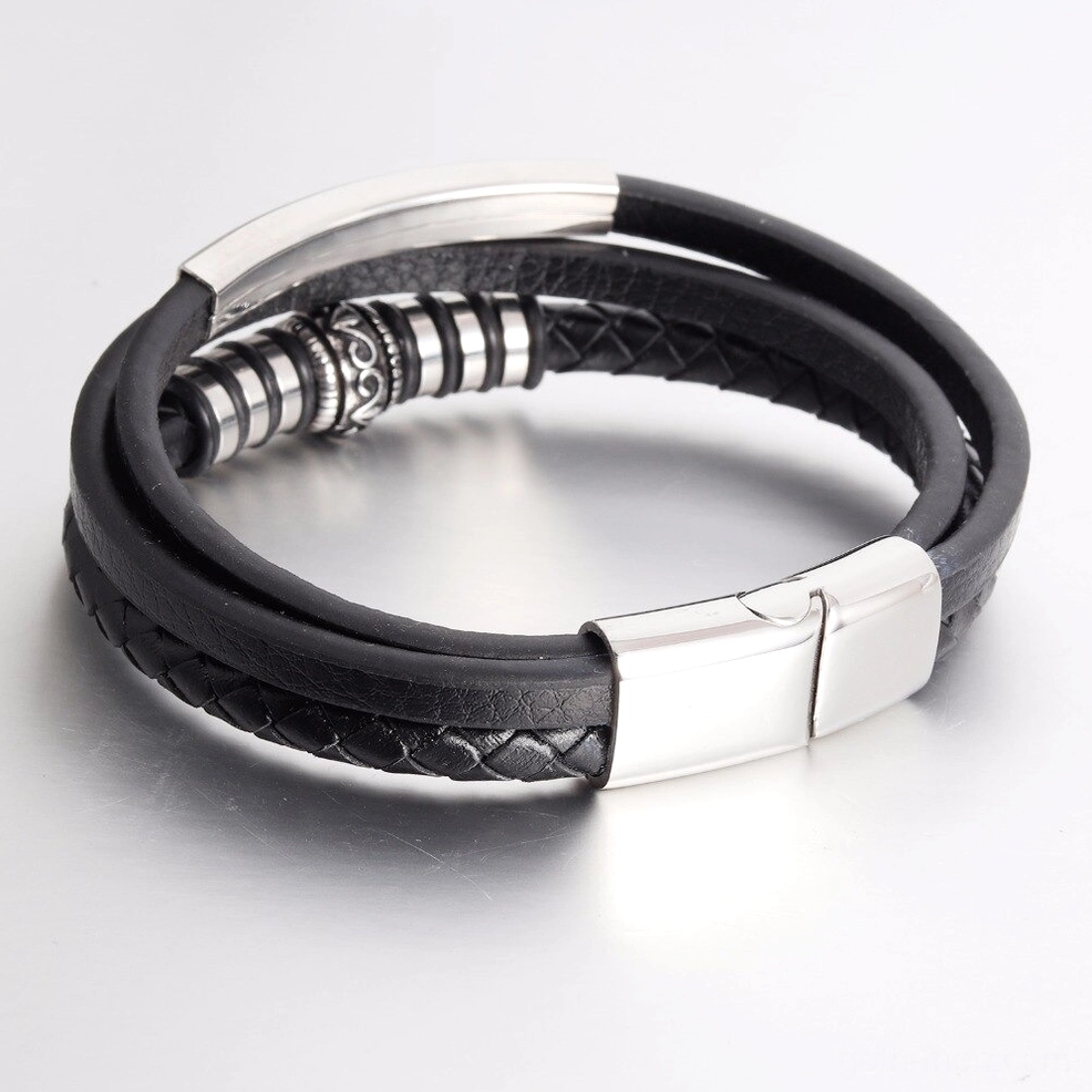 Men's genuine leather bracelet with ornate silver beaded center accent - flat lay