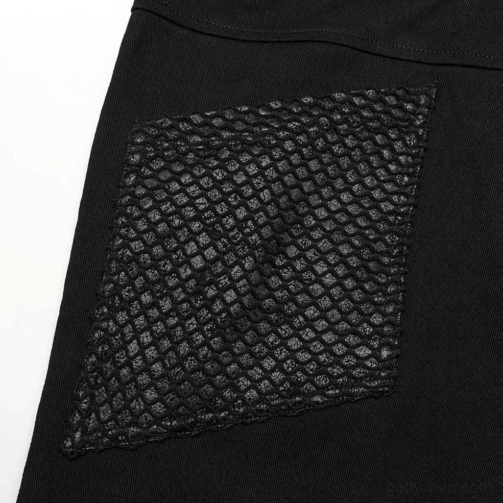 Close-up flat lay showing quilted mesh back pocket patch attached to black twill base fabric