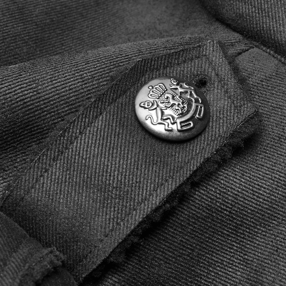 Detail shot of military gothic coat crest-embossed metal button and twill fabric texture