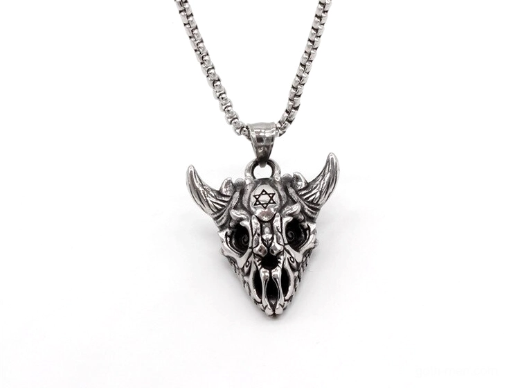 Miniature horned skull pendant necklace showcasing silver stainless steel compact gothic statement piece