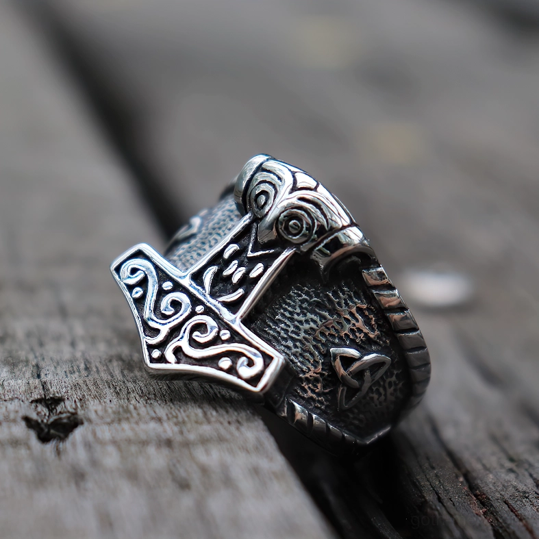 Mjolnir head close-up detail - intricate Celtic hammer design and Norse knotwork on stainless steel ring