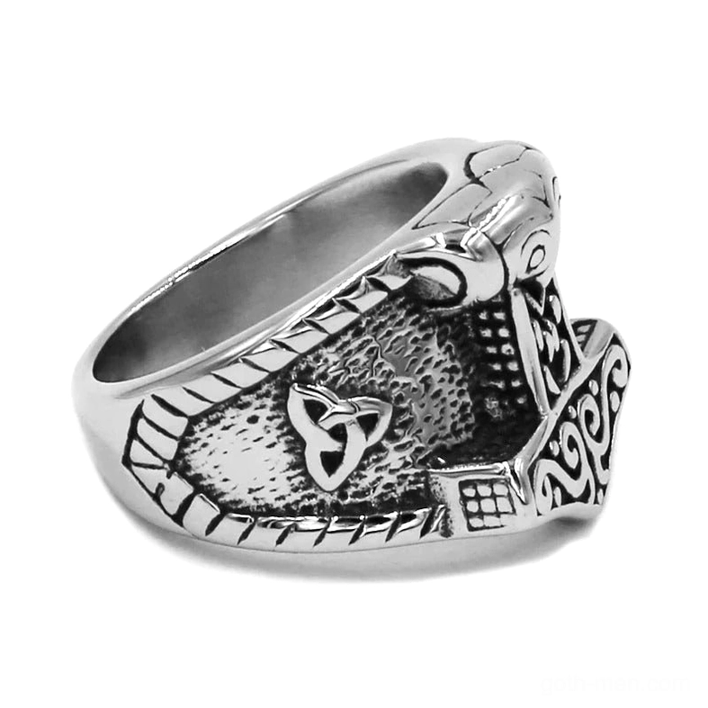 Mjolnir hammer ring three-quarter perspective displaying polished stainless steel surface and Celtic knot motifs