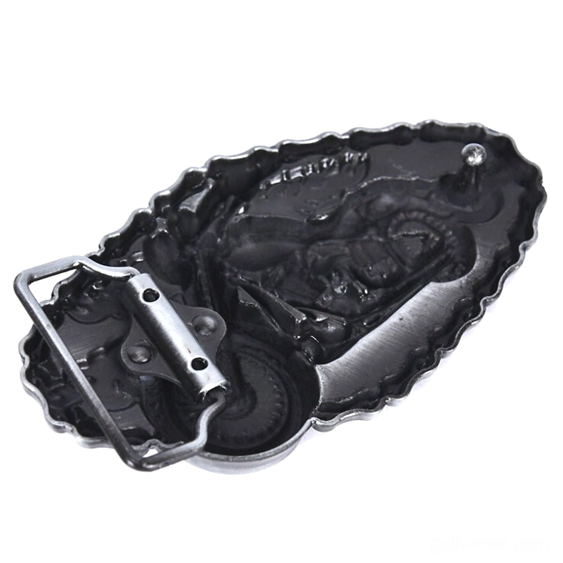 Low side angle close-up of buckle rear structure showing embossed relief, mounting studs, and dimensional depth of the design