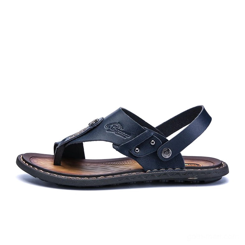 Navy blue convertible gothic sandals with foldable heel strap and metal rivets - front angle