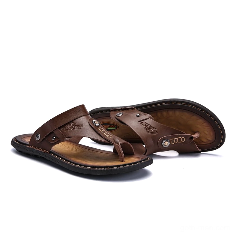 Navy gothic sandals with embossed branding and metal accents - premium detail shot
