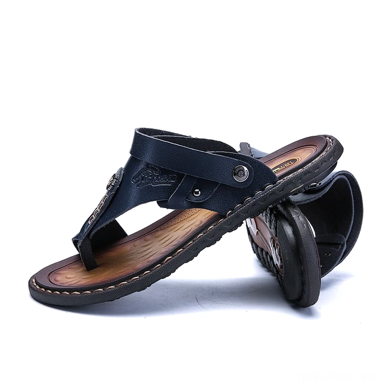Navy blue convertible gothic sandals stacked display - low side angle view