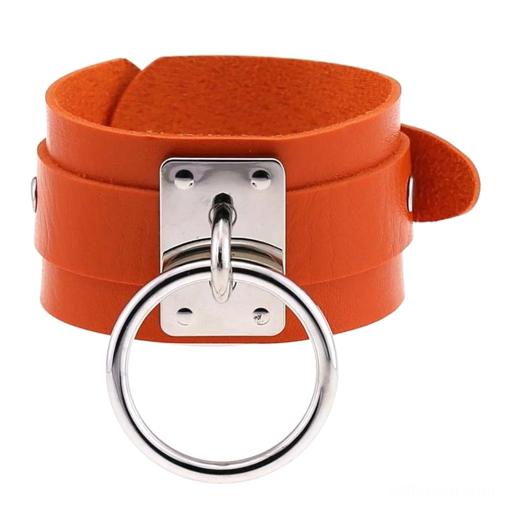 Orange leather gothic cuff bracelet with silver metal rings, vibrant alternative accessory
