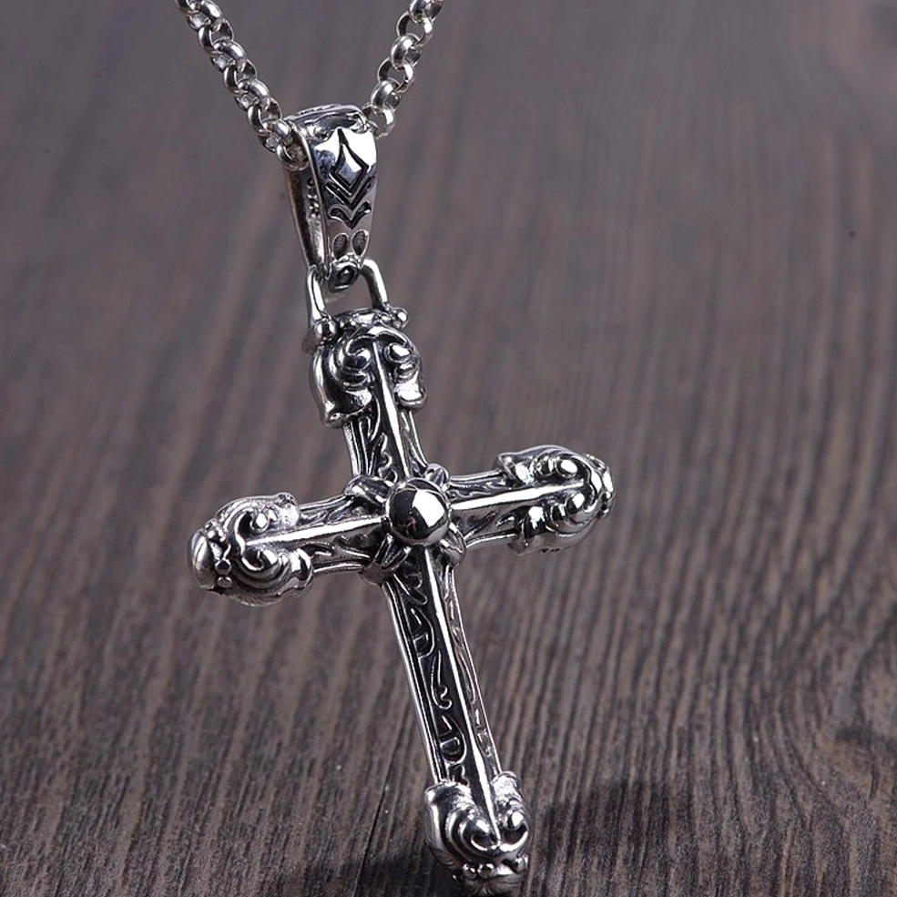 ornate gothic cross pendant necklace featuring intricate carved patterns and decorative metal work, front view detail