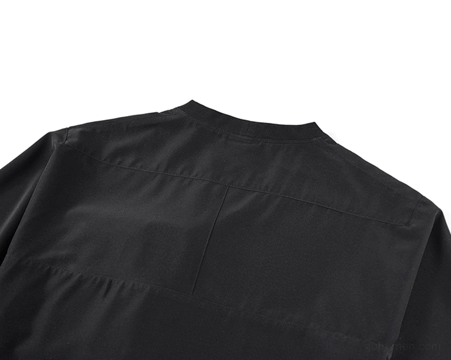 Black oversized utility T-shirt back panel showing relaxed silhouette and reinforced construction seams