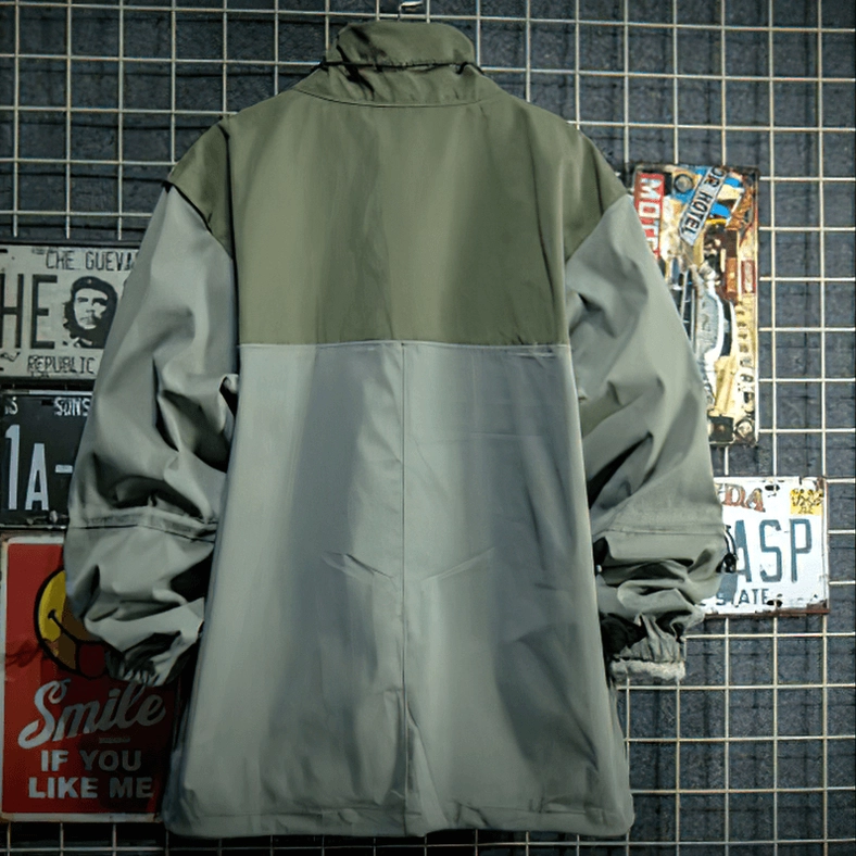 Two-tone green and gray gothic patchwork jacket back view showing elasticated sleeve cuffs and loose fit