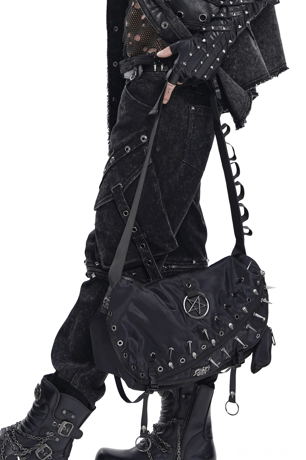 Close-up detail of metal hardware and spiked studs on black gothic crossbody bag, showing industrial craftsmanship