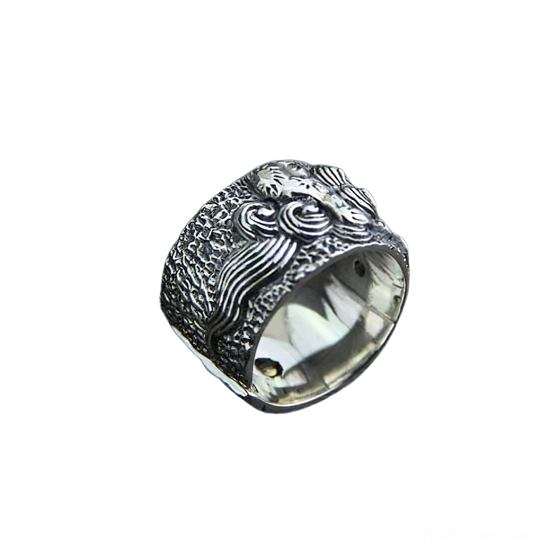 Vintage silver protective lion ring oblique angle displaying wave pattern carving and textured base