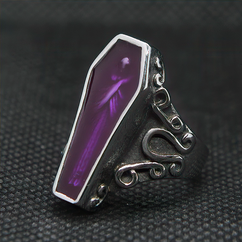 Coffin mummy ring right three-quarter angle highlighting enamel and engraved details on dark background