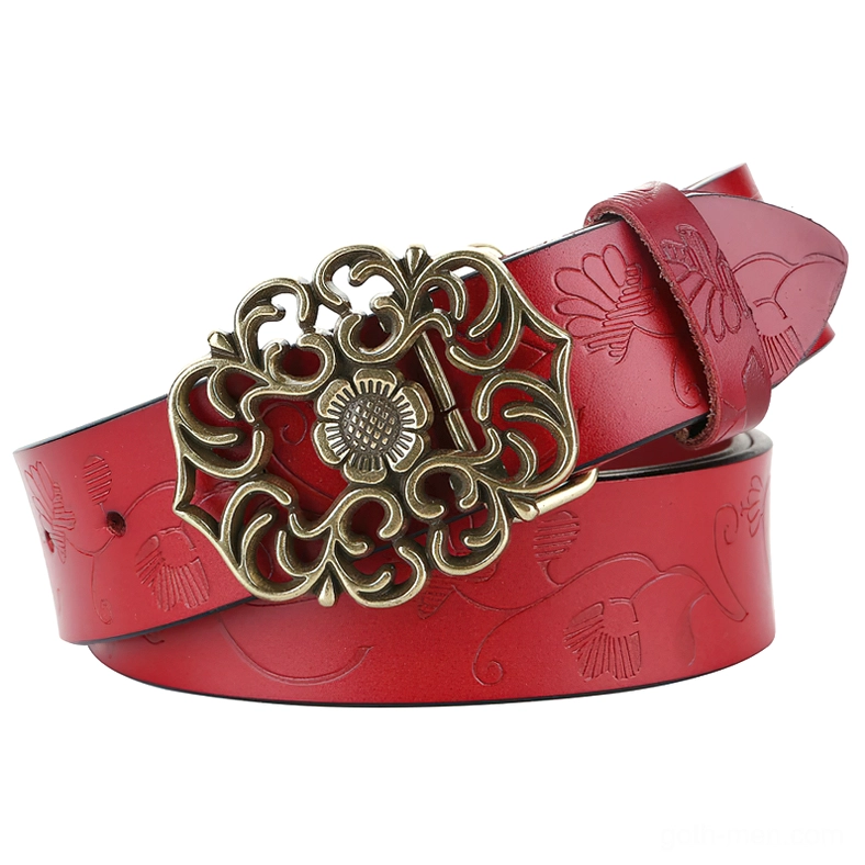 Red leather gothic women's belt with embossed floral designs and ornate carved bronze pin buckle