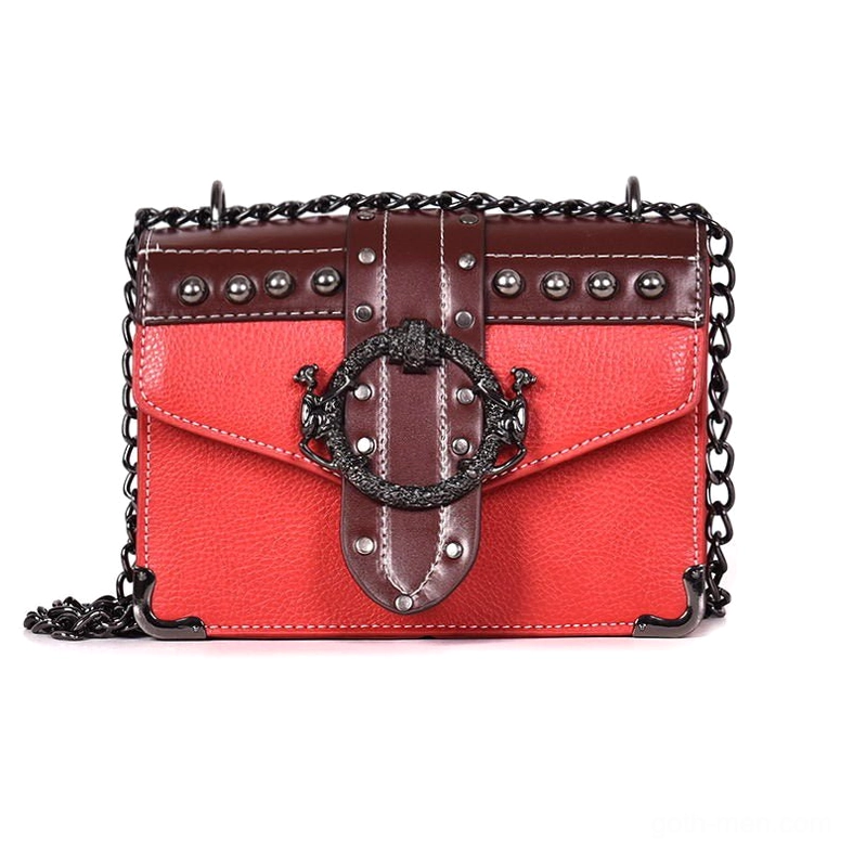 Red gothic square shoulder bag with metal chain strap and rivet details, front view flat lay