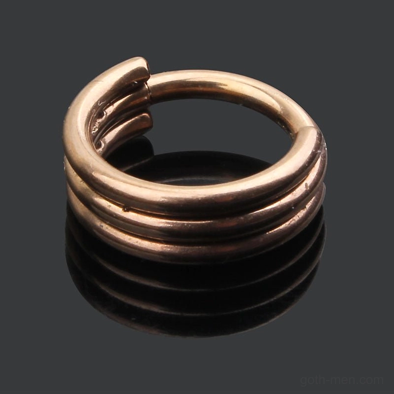 Rose gold triple-layer hinged nose ring overhead view - polished finish reflecting studio lighting with stacked triple-band structure visible