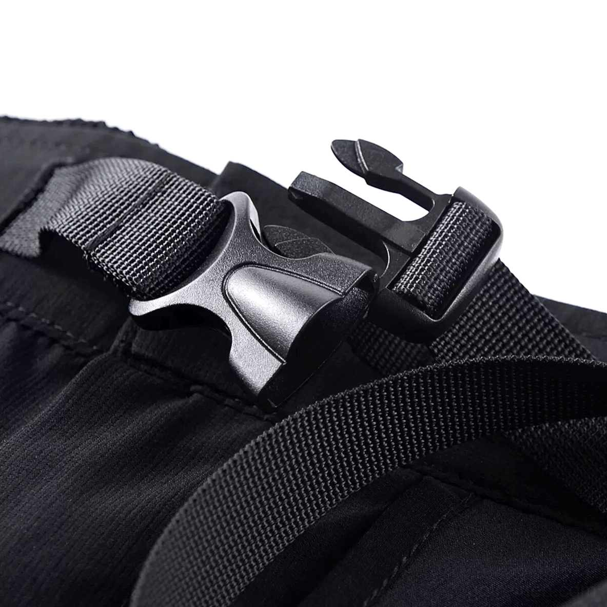 Quick-release buckle closeup - durable plastic waist adjustment system with webbing band