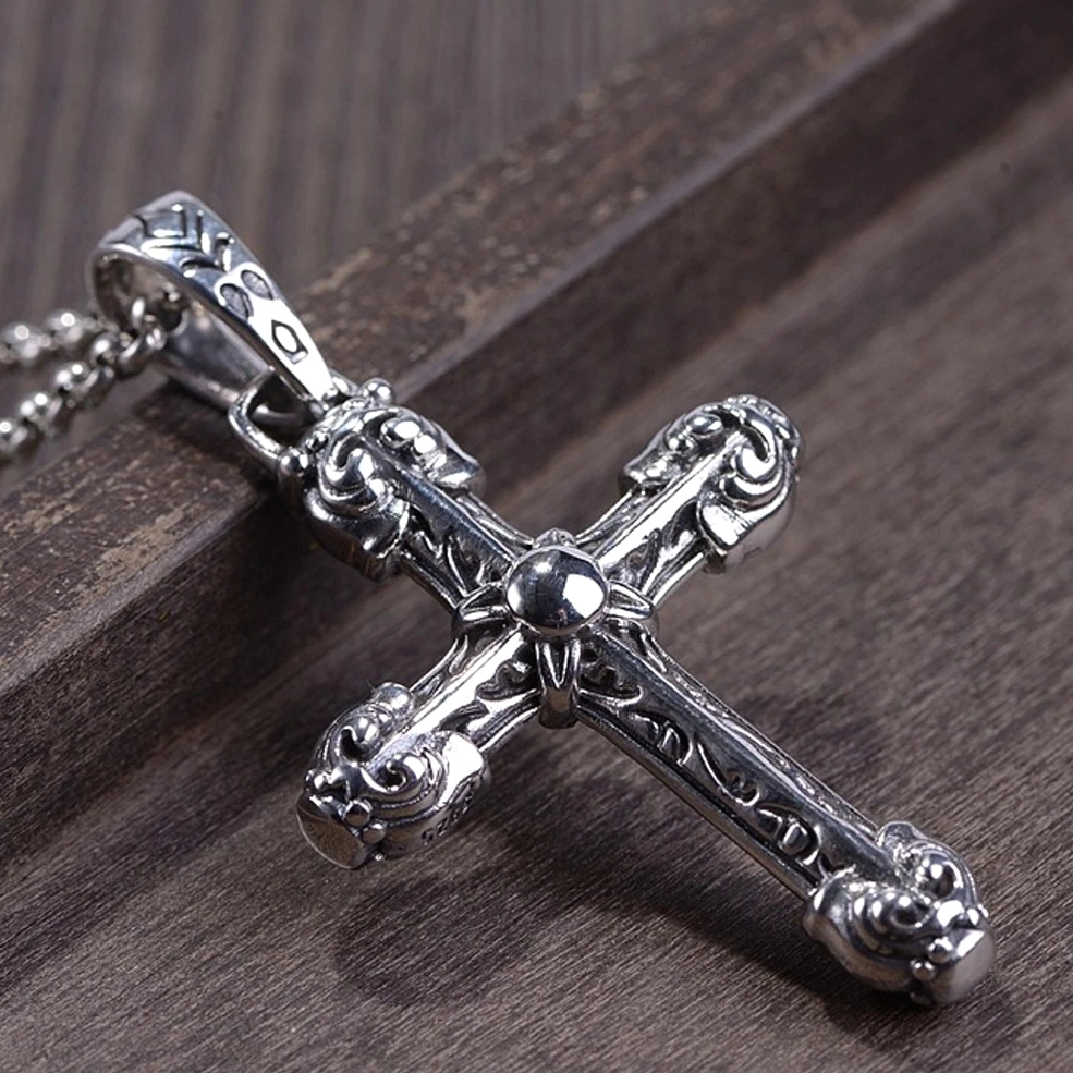 polished 925 silver gothic cross pendant with round center joint and engraved scrollwork, side close-up detail