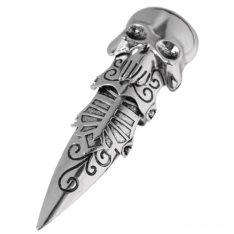 Silver gothic skull claw ring - top-down flat lay view with intricate scroll engravings and jointed pointed design