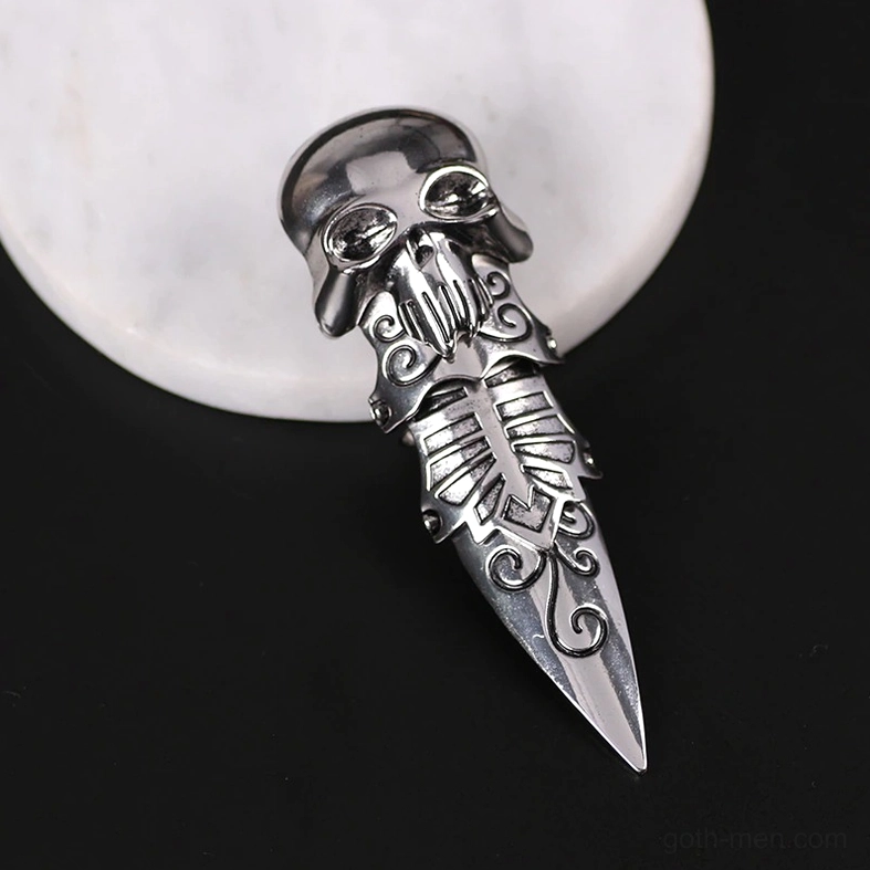 Silver gothic skull claw ring - oblique view with engraved skull head and ornamental scroll patterns
