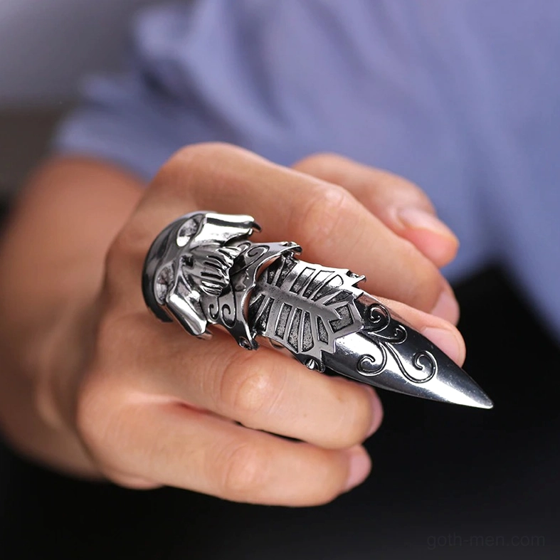 Silver gothic skull claw armor ring worn on index finger - close-up side view showcasing articulated structure