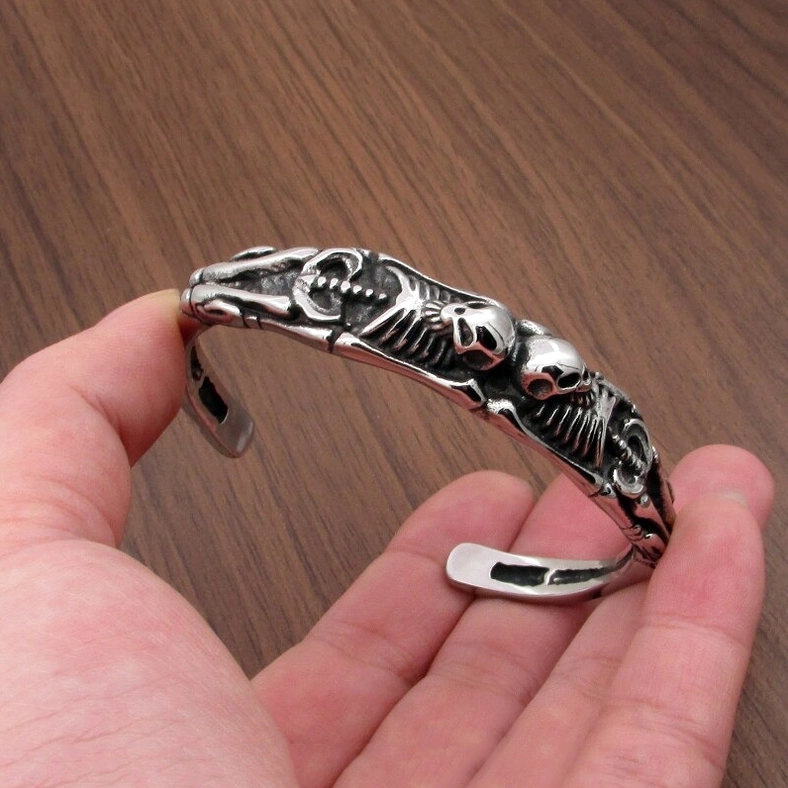 Skeleton cuff bracelet worn on hand showing fit, size, and carved skull details – stainless steel gothic bracelet styling