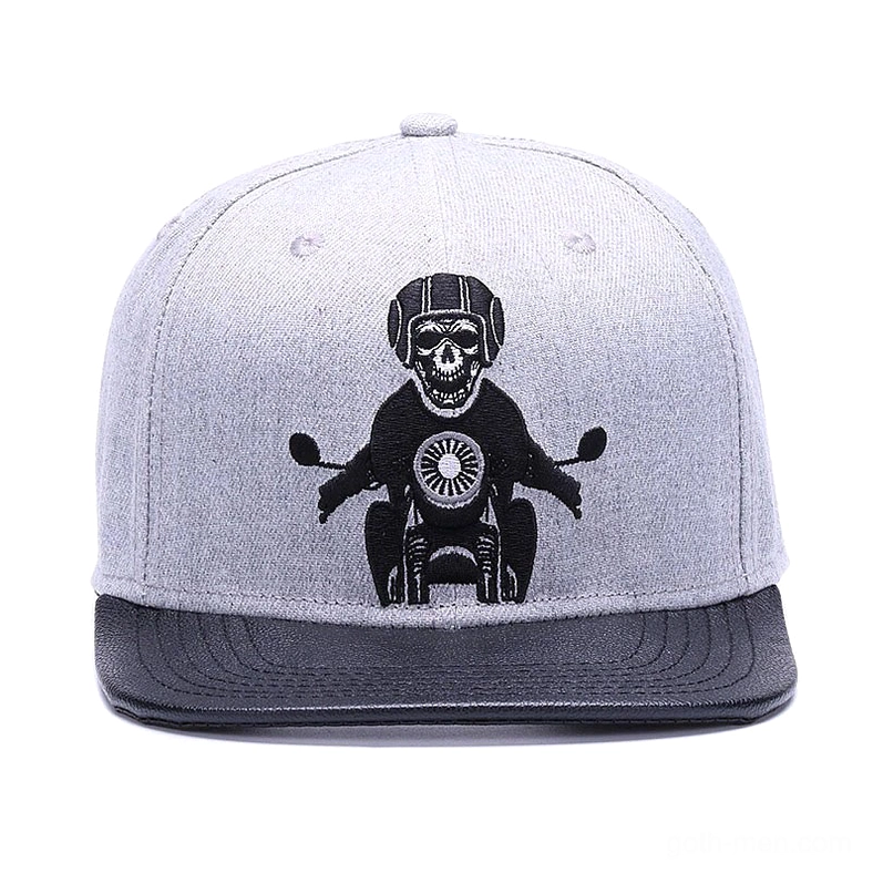 Front view of skeleton motorcyclist gothic cap with bold embroidered skull biker design and flat brim