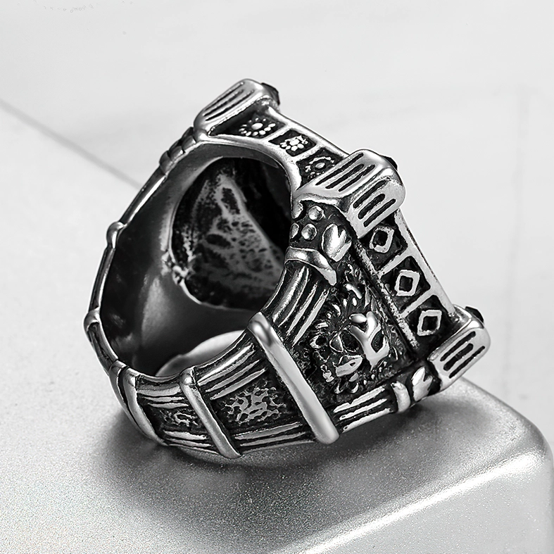 Memento mori skull band ring low angle showing inner band engravings and full side pattern details on stainless steel